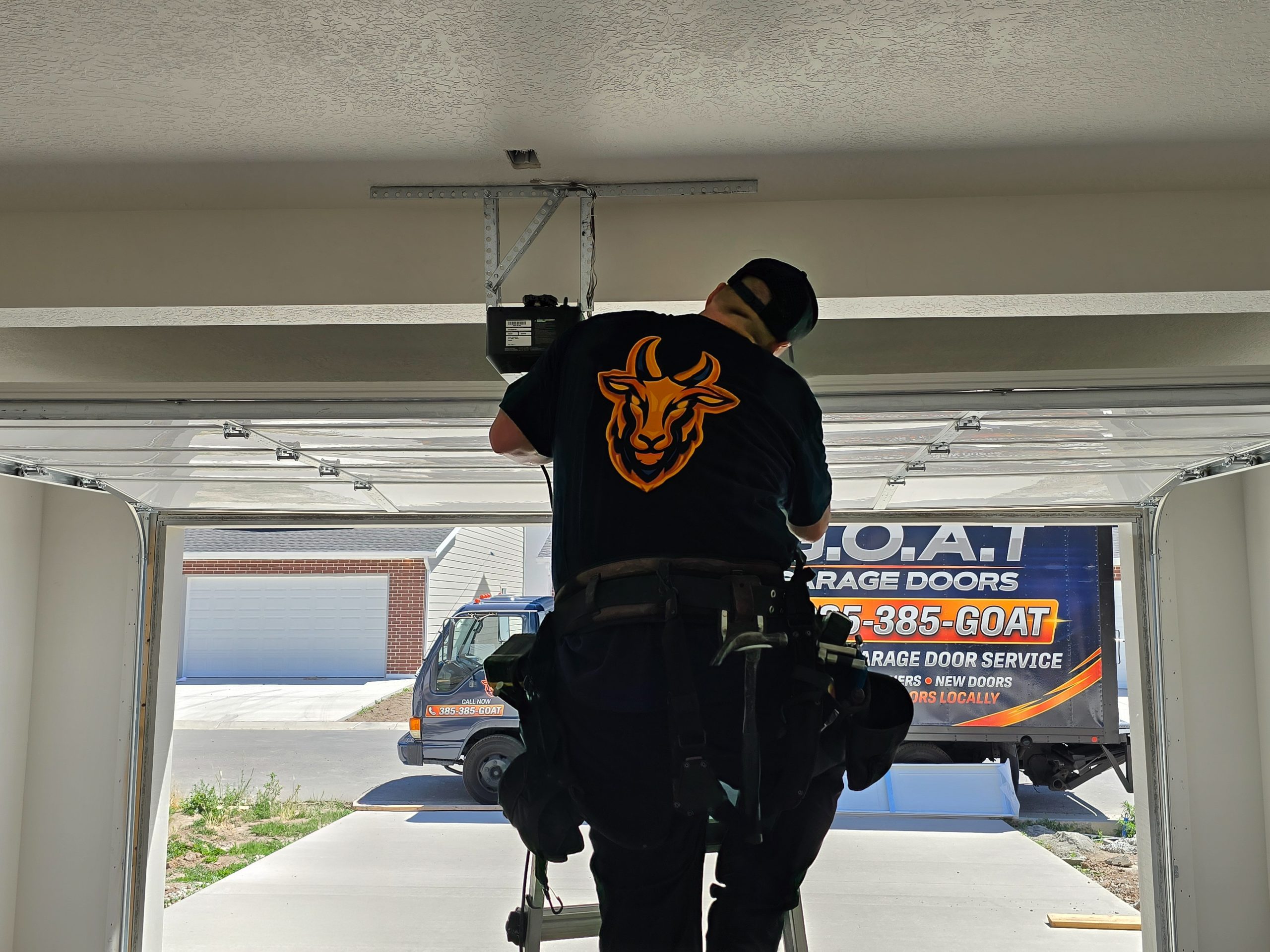 GOAT technician performing an emergency garage door repair