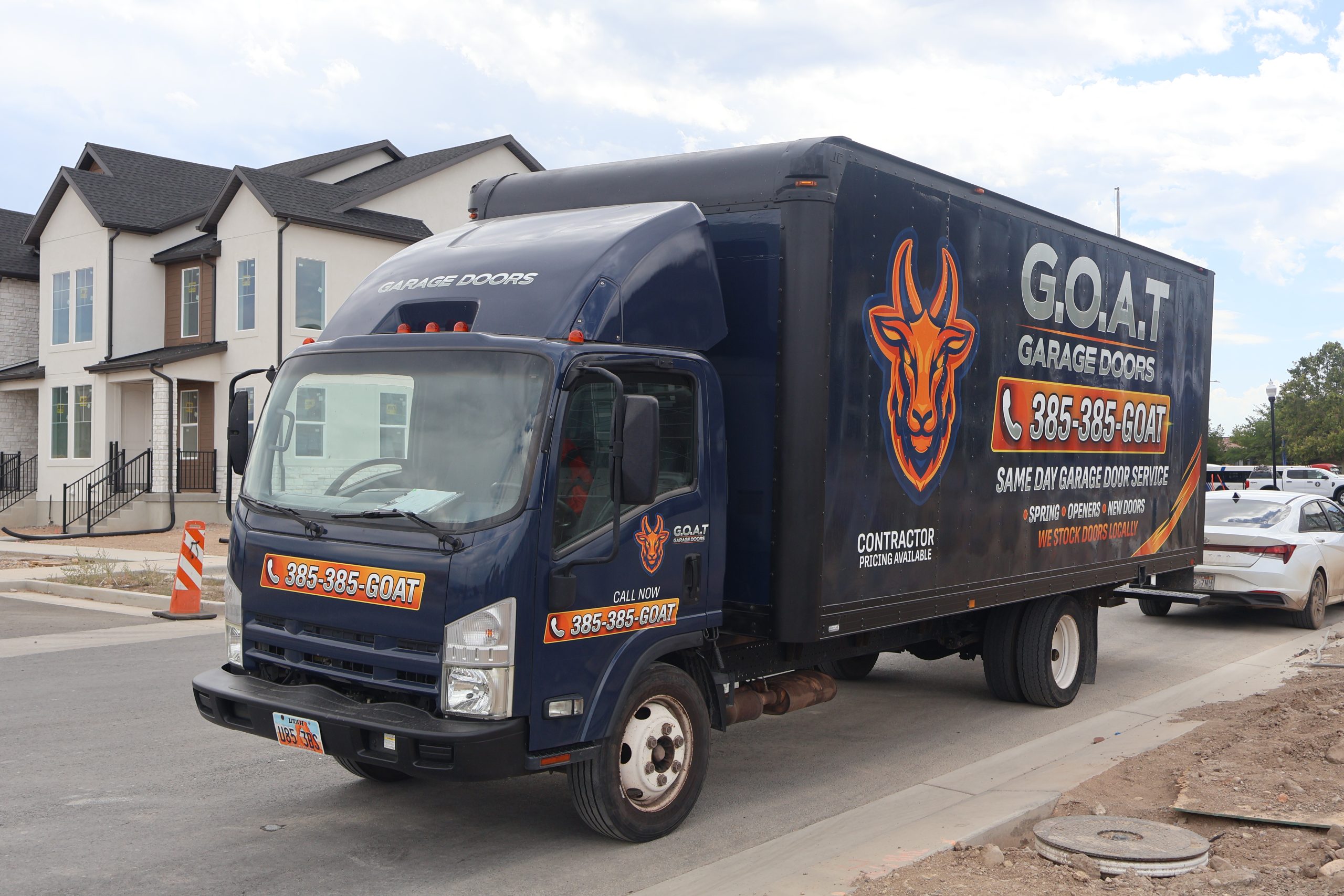 Modern glass garage door installed by GOAT Garage Doors