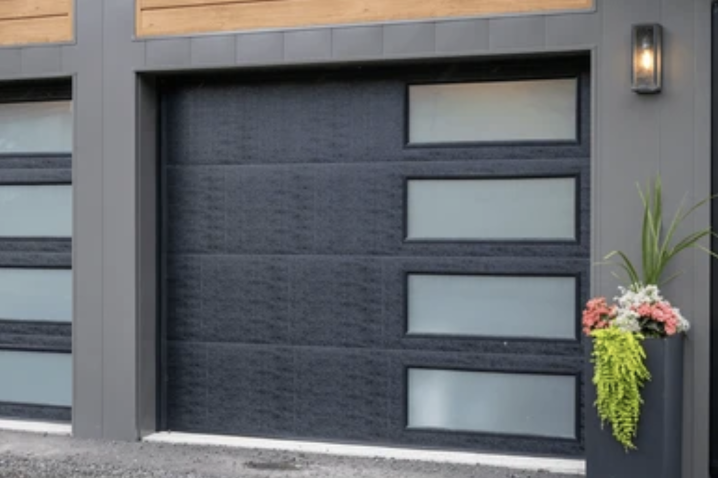 Modern residential garage door with sleek horizontal accent lighting