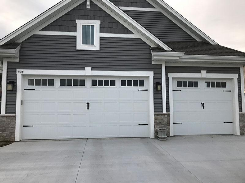 Traditional garage door matched to home architecture