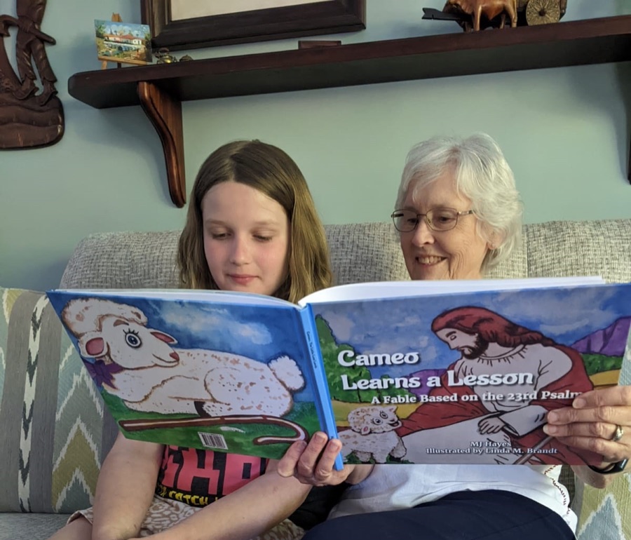 A child reading with an adult